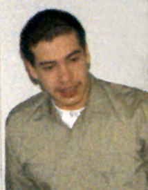 photo of Louis H. Reyes wearing green shirt