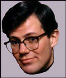 Head photo of Dean Lewis, wearing glasses