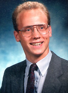 head photo of Earl "Eric" Dunckel; wearing suit jacket and glasses
