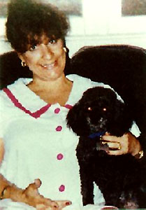 home photo of Sandra A. Sollie with dog in lap